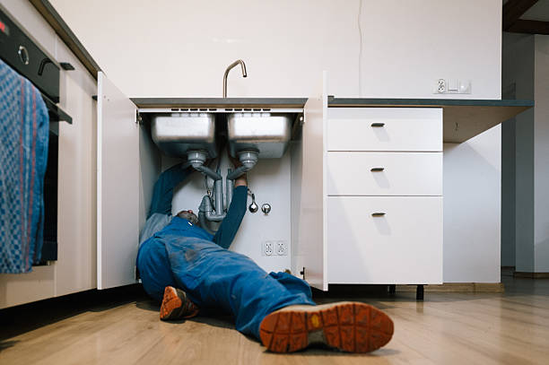 Professional Drain Cleaning technician working in Tilton, NH